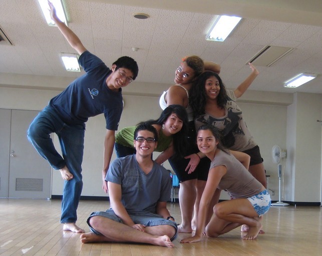 Group of exchange students posing in a dance studio