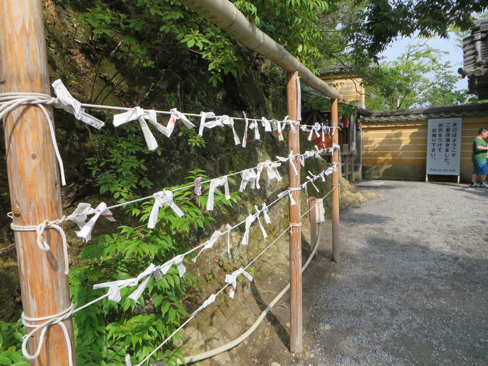 Letters tied to rows of rope with messages of hope or wishes written on them