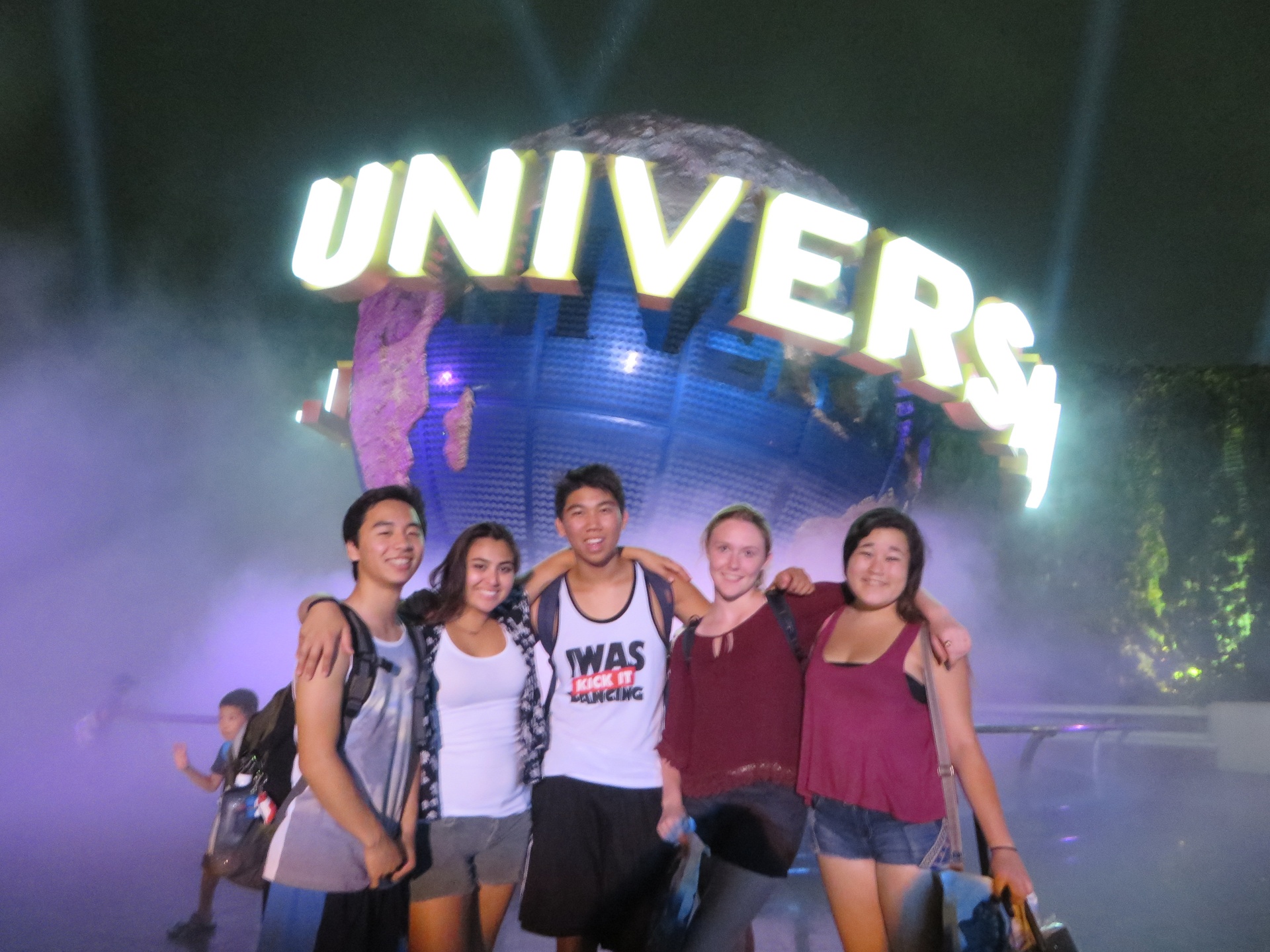 Students in front of Universal Studios sign in Japan